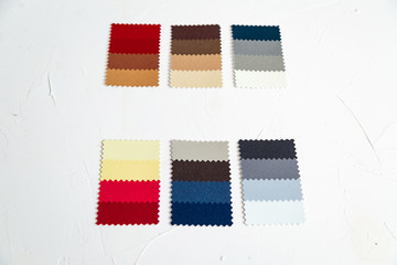 Top view of colorful  felt  swatches on white background. Instrument for color type determination&