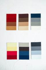 Top view of colorful  felt  swatches on white background. Instrument for color type determination&