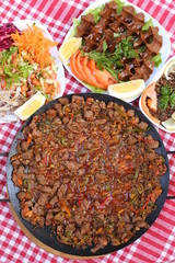 diced lamb fried on iron plate 