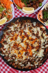 diced lamb fried with cheese on iron plate 