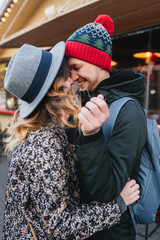 Obraz premium True love emotions of joyful cute couple enjoying time together outdoor in city. Lovely happy moments, having fun, smiling, christmas time, dating, falling in love