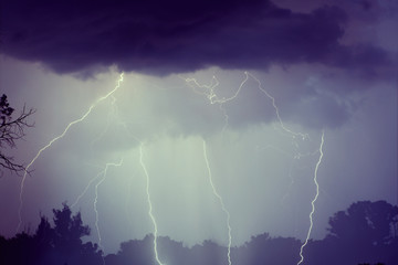 Thunder lightnings and storm on the dark sky