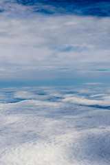 view from the plane at the clouds