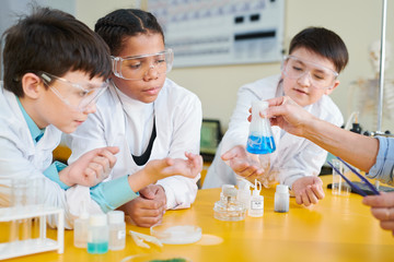 Kids at chemistry lesson