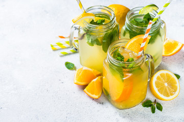 Lemonade, mojito and orange lemonade on white.