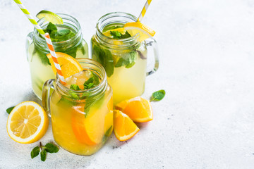 Lemonade, mojito and orange lemonade on white.