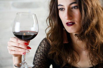 Young beautiful woman is talking on a blind date. The emotion of thought and sadness. Closeup portrait.