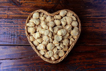 Soybean meat, chunks in a basket with heart shape. Raw soybeans chunks on rustic wooden background