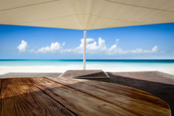 Desk of free space and beach background 