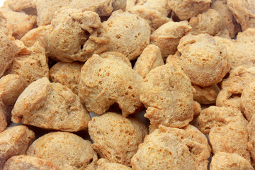 Soy meat in chunks on white background. Raw soybeans chunks