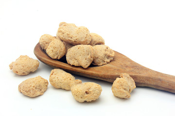 Soy meat in chunks on white background. Raw soybeans chunks