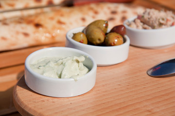 snacks on a wooden board shot close-up