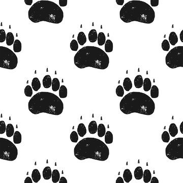 Bear paw pattern. Bear Claw seamless background. Footprint wallpaper. Vintage hand drawn silhoutte style. Stock Vector illustration isolated