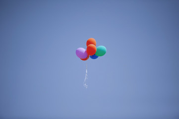 Fototapeta na wymiar Colorful balloons flying in the sky