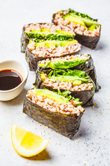 Vegetable onigirazu with brown rice, avocado and cucumber.