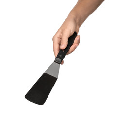 Woman holding spatula on white background. Kitchen utensils