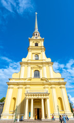 Fototapeta na wymiar Saint Peter and Paul cathedral, the tallest bell tower in Orthodox church, located in St.Peter&Paul fortress in Saint Petersburg, Russia, under cloudy blue sky