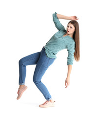 Young woman attracted to magnet on white background