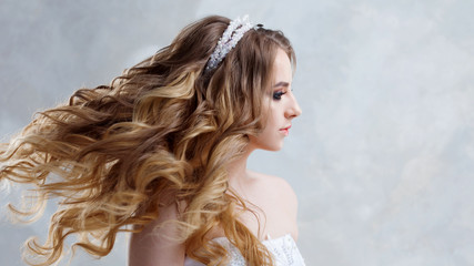 Beautiful young bride with lush curls, Wedding fashion
