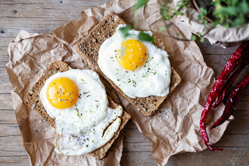 Sandwich of bran bread and seeds with eggs for breakfast