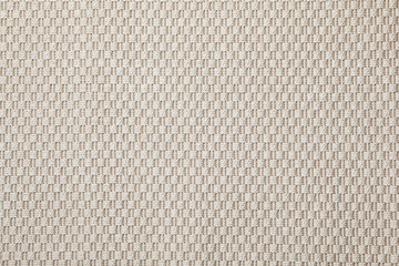 Beige woven carpet texture as background, top view