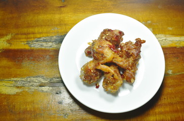 crispy fried buffalo wing dressing sweet chili sauce on dish