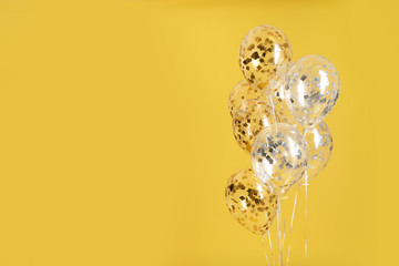 Bunch of bright balloons on color background. Space for text