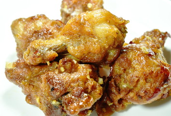 crispy fried chicken leg dressing sweet chili sauce on dish
