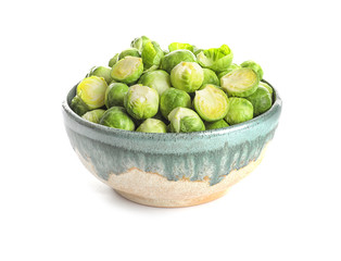 Bowl of fresh Brussels sprouts isolated on white