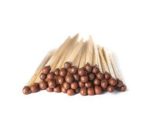 Pile of wooden matches on white background