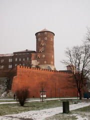 Tower of Wawel castle in Krakow, Poland. Winter photo with brick wall