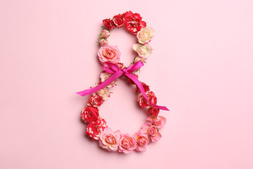 Number 8 made of beautiful flowers on color background, top view. Happy Women's Day