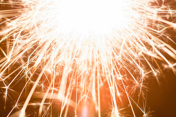 Bright Sparks Flying From Sparkler At Night