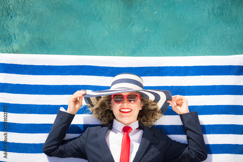 Wall mural successful young businesswoman on a beach