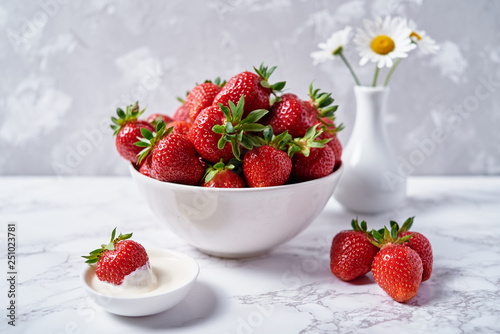 Red Organic Strawberries In White Ceramic Bowl Cream And