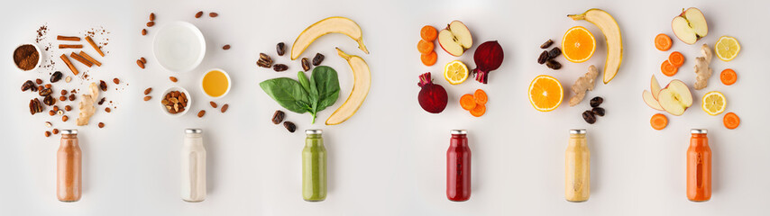 Long set of detox cocktails in bottles and ingredients on white background