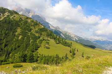 Fototapeta na wymiar Mountain landscape of the Dolomites, with green pastures and mountain peaks, Dolomites, Italy