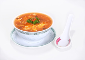 Traditional Chinese soup with typical Chinese / Asian dishes and spoon