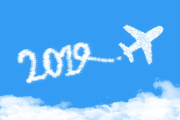 Airplane shape clouds 2019 route. Happy new year concept