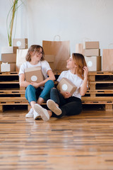 Two young girls entrepreneurs packing boxes for shipping, delivery. Home business. Beauty box. Packing gift, present boxes.