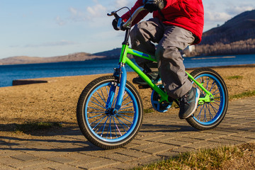 the child turns two-wheeled pedal bike