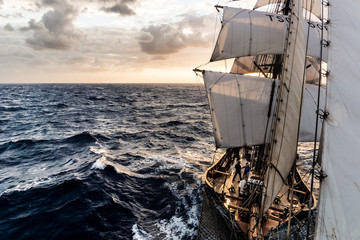 Ship sailing on the Atlantic Ocean at sunrise © Anton Blanke
