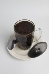 A glass of kopi tubruk, a traditional coffee serving ini Indonesia