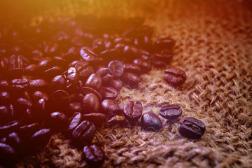 select coffee roasted beans on sacking background