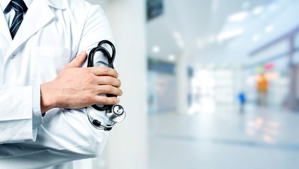 Young man doctor holding stethoscope
