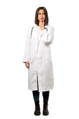 A full-length shot of a Young doctor woman thinking over isolated white background