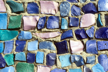 Shards of multicolored glass embedded in concrete