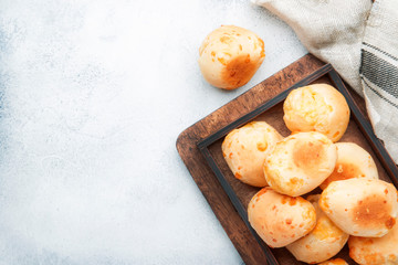 Appetizing homemade sweet buns on gray kitchen table background, top view. Place for text