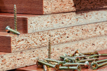 number of screws on the wooden background