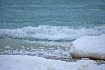 Ice and snow on shoreline of ocean
